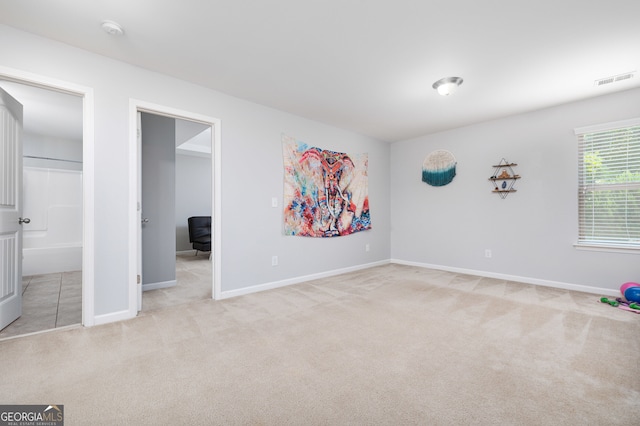 unfurnished bedroom with light carpet