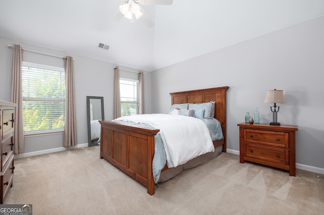 carpeted bedroom with ceiling fan and lofted ceiling