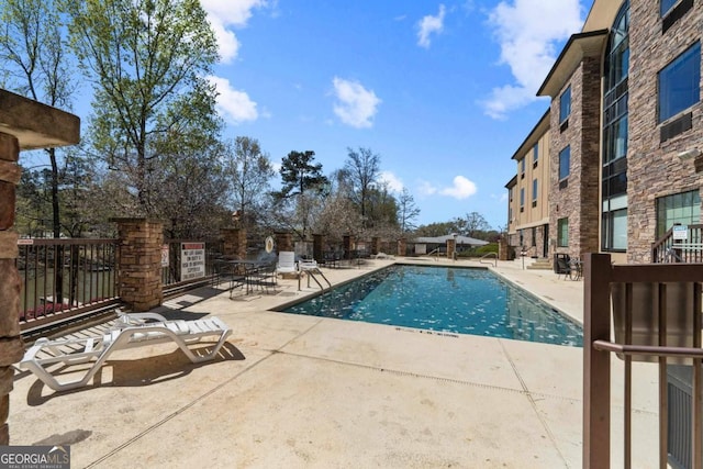 view of pool featuring a patio