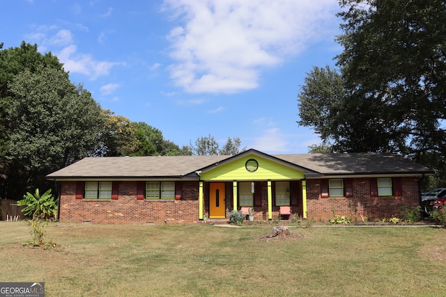 ranch-style home featuring a front yard