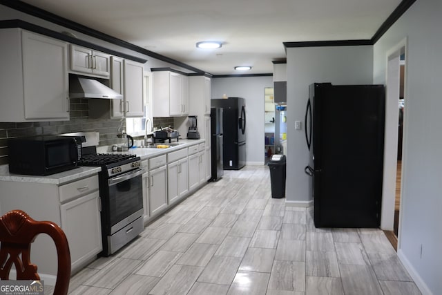 kitchen with white cabinetry, sink, black appliances, extractor fan, and ornamental molding