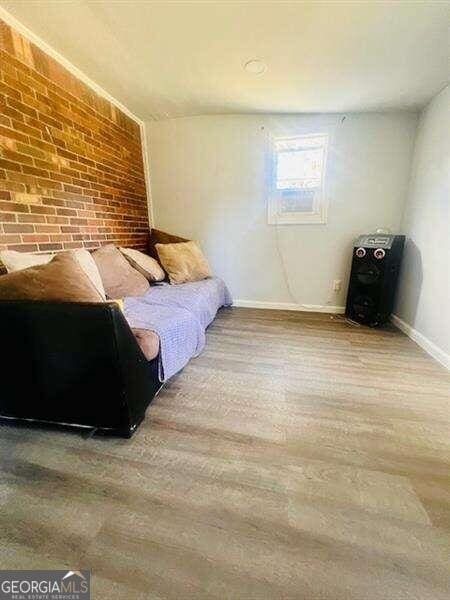 bedroom with hardwood / wood-style floors