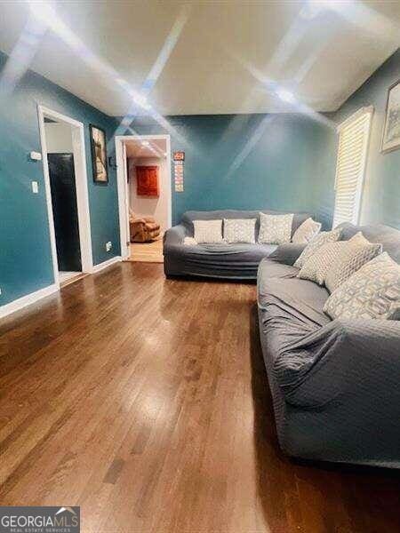 living room with wood-type flooring