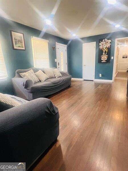 interior space featuring hardwood / wood-style flooring and a wealth of natural light