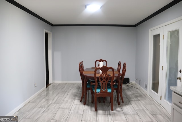 dining room featuring ornamental molding