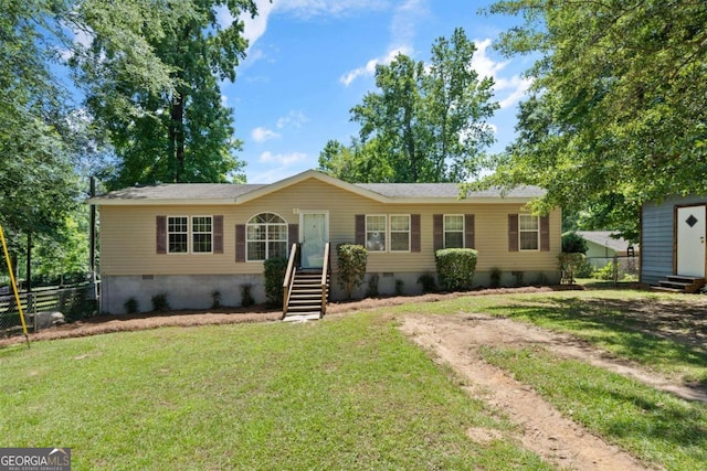 single story home featuring a front yard