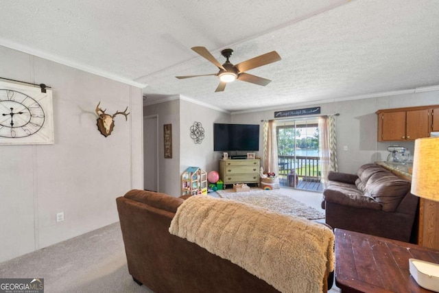 living room with light carpet, a textured ceiling, ornamental molding, and ceiling fan