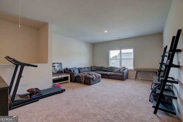 exercise room with light colored carpet