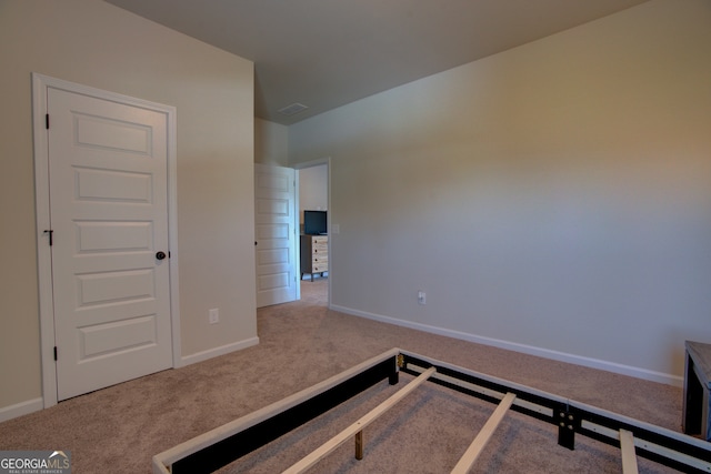 interior space featuring light colored carpet