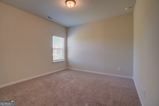 unfurnished room with carpet