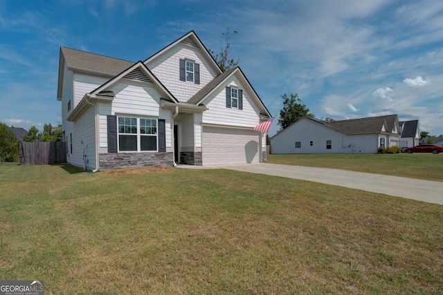 view of front of property featuring a garage and a front lawn