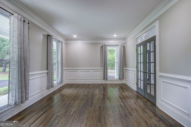 unfurnished room with french doors, ornamental molding, and dark hardwood / wood-style flooring