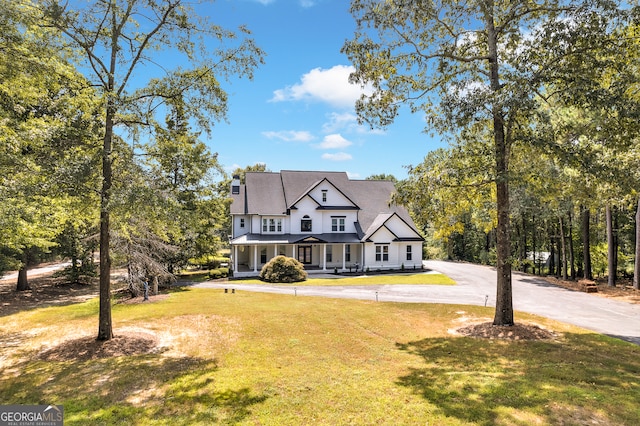 view of front of house with a front lawn and covered porch