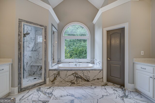 bathroom with vaulted ceiling, shower with separate bathtub, and vanity