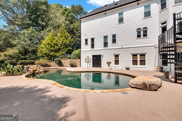 view of pool featuring a patio area