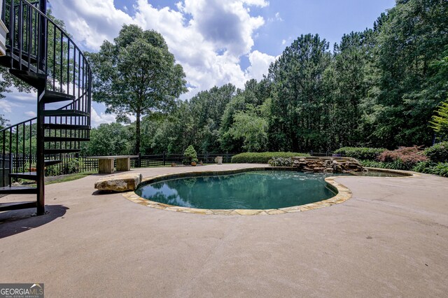 view of pool featuring a patio area