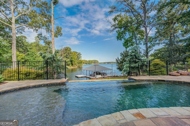 view of swimming pool featuring a water view