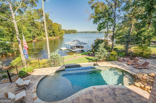 view of pool with a water view and a patio area