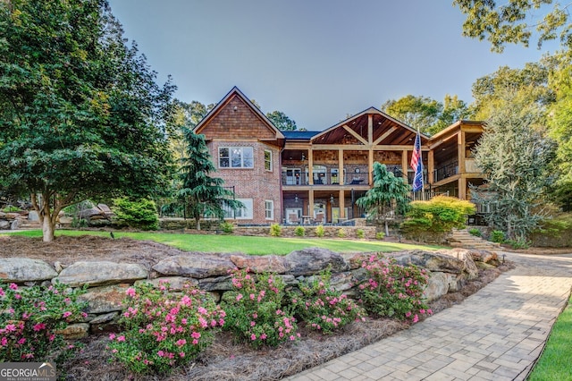 rear view of property with a balcony