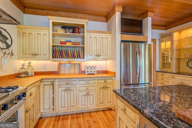 kitchen featuring wooden counters, appliances with stainless steel finishes, wooden ceiling, and light hardwood / wood-style floors