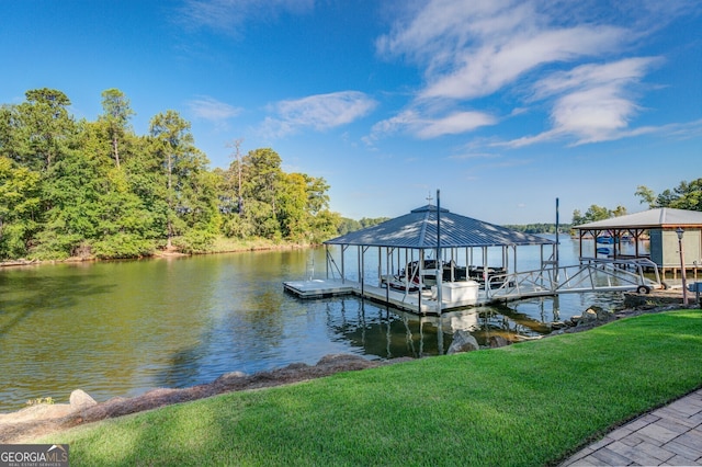 dock area featuring a water view and a yard