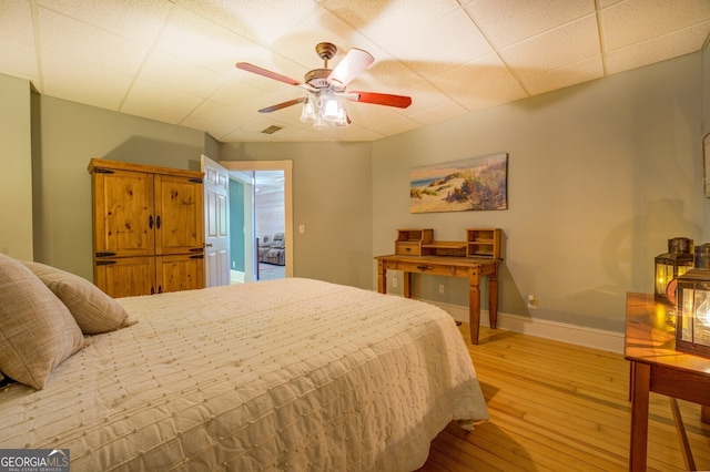 bedroom featuring wood-type flooring and ceiling fan