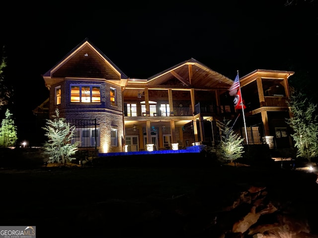 back house at night with a balcony