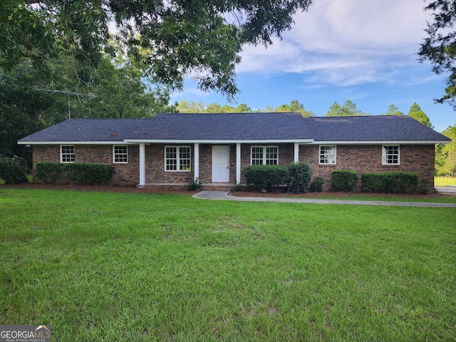 single story home with a front yard