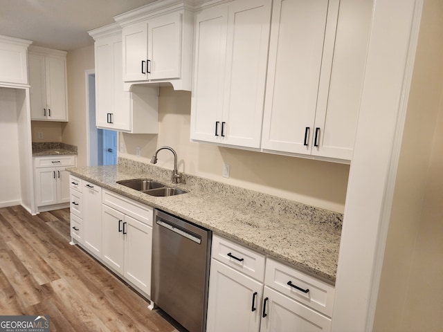 kitchen featuring dishwasher, light hardwood / wood-style flooring, light stone countertops, white cabinetry, and sink