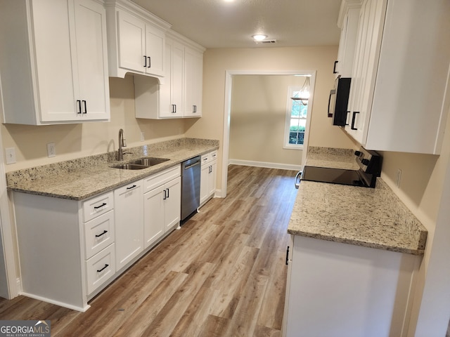 kitchen featuring white cabinets, dishwasher, light hardwood / wood-style flooring, sink, and black range oven