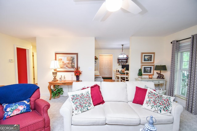 carpeted living room featuring ceiling fan