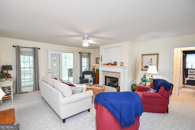 carpeted living room featuring ceiling fan