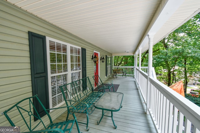 wooden terrace featuring a porch