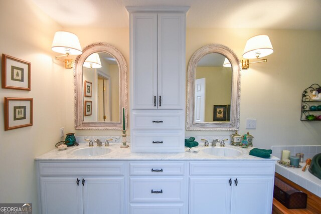 bathroom featuring hardwood / wood-style flooring and vanity