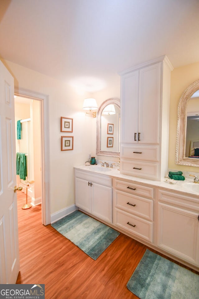 bathroom featuring hardwood / wood-style floors and vanity