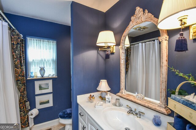 bathroom with vanity and toilet