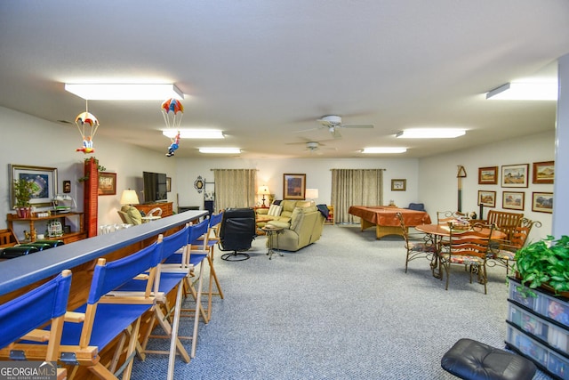 interior space with ceiling fan