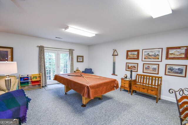 game room featuring carpet flooring, billiards, a textured ceiling, and french doors