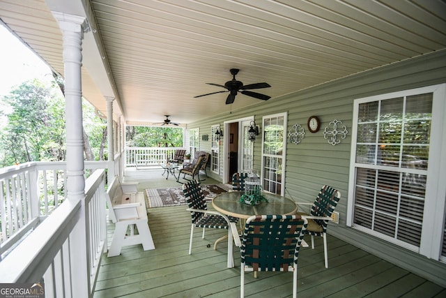 wooden deck featuring ceiling fan