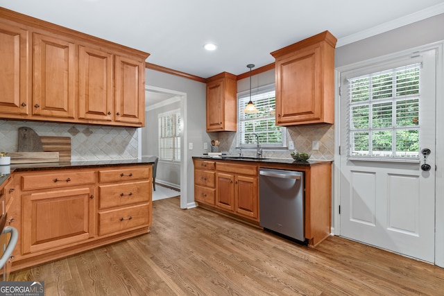 kitchen with dishwasher, pendant lighting, ornamental molding, sink, and light wood-type flooring