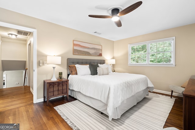 bedroom featuring ceiling fan and dark hardwood / wood-style flooring