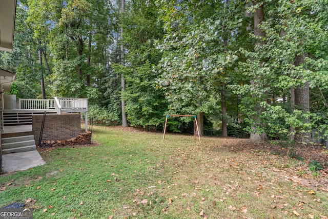 view of yard featuring a wooden deck