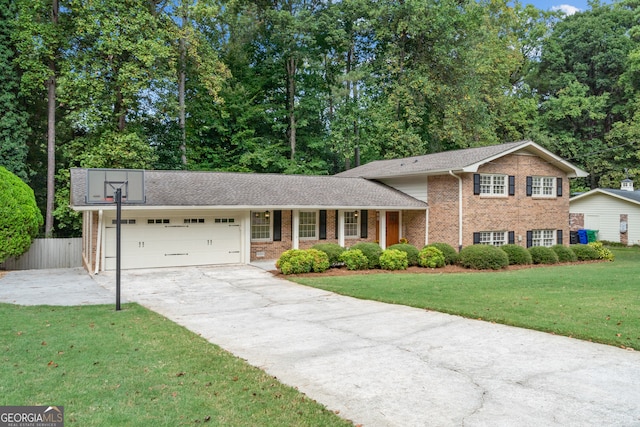 split level home with a front yard and a garage