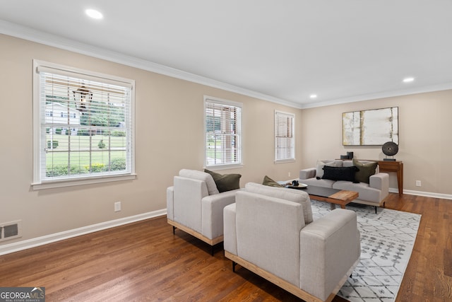 living room with ornamental molding and dark wood-type flooring