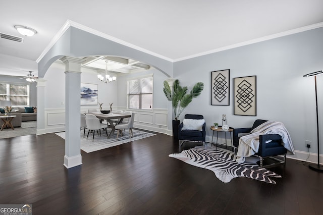 sitting room featuring ceiling fan with notable chandelier, dark hardwood / wood-style floors, crown molding, and coffered ceiling