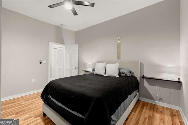 bedroom featuring hardwood / wood-style flooring and ceiling fan