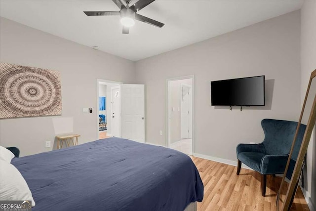 bedroom with light hardwood / wood-style flooring and ceiling fan