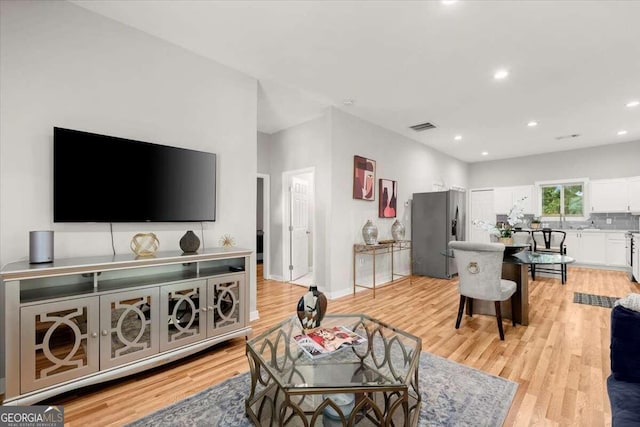 living room with light hardwood / wood-style floors