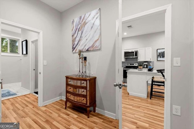 hallway featuring light hardwood / wood-style floors