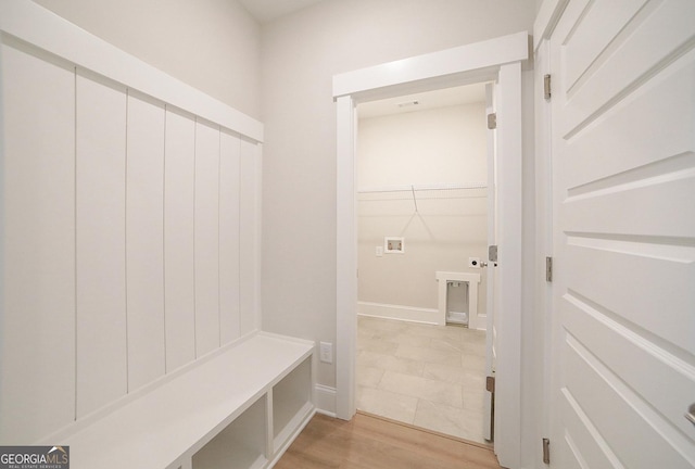 mudroom with light hardwood / wood-style floors